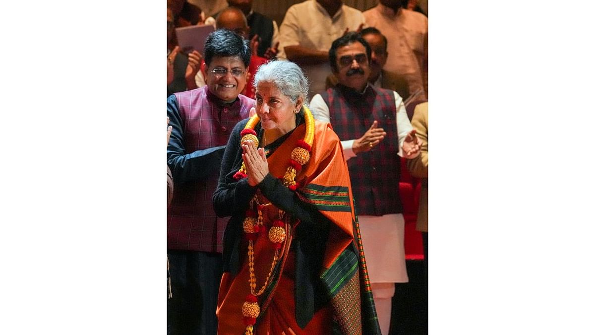 Finance Minister Nirmala Sitharaman gestures after being felicitated by BJP National President JP Nadda for presenting a successful Union Budget 2023-24 during the BJP Parliamentary Party meeting in New Delhi. Credit: PTI Photo