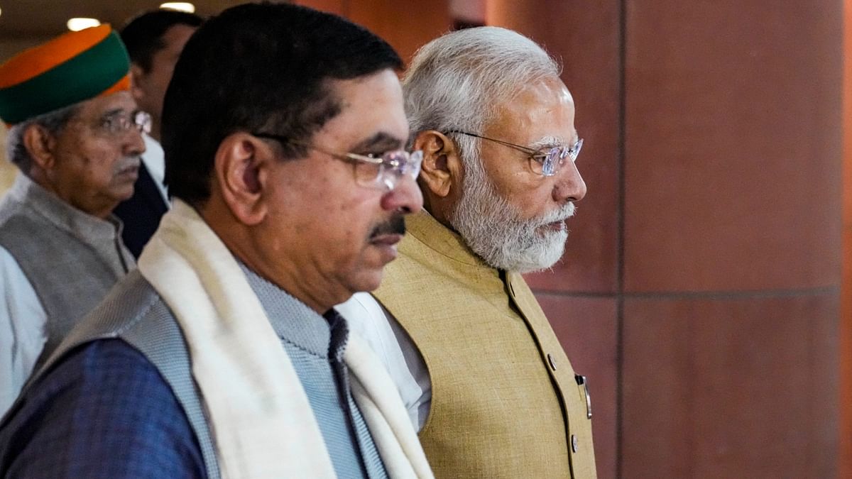 Prime Minister Narendra Modi and Union Parliamentary Affairs Minister Pralhad Joshi arrive for the BJP Parliamentary Party meeting in New Delhi. Credit: PTI Photo