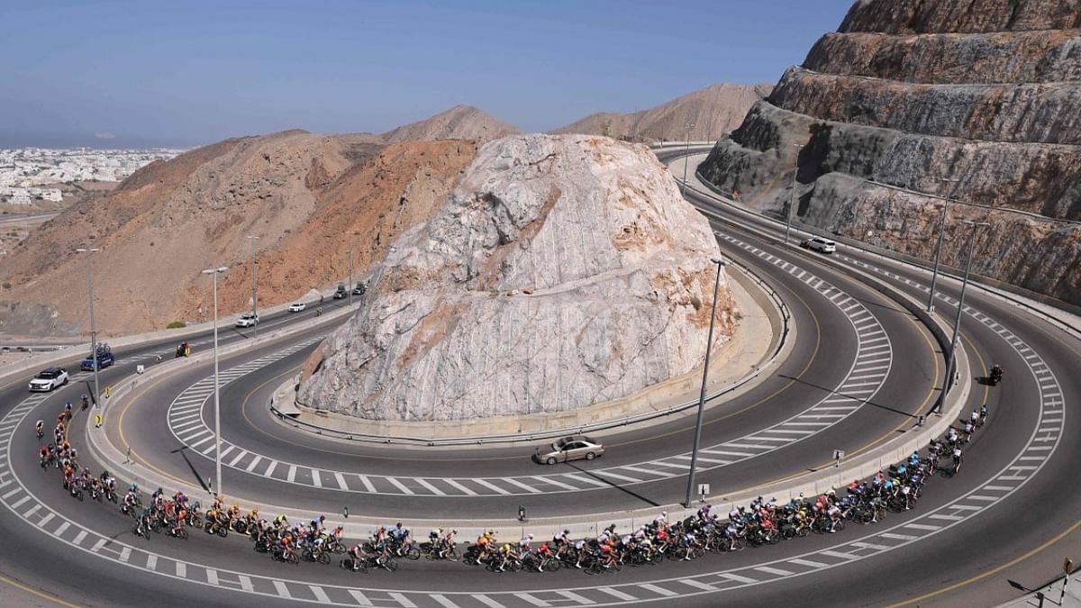 The pack rides during the first edition of the Muscat Classic on February 10, 2023. Credit: AFP Photo