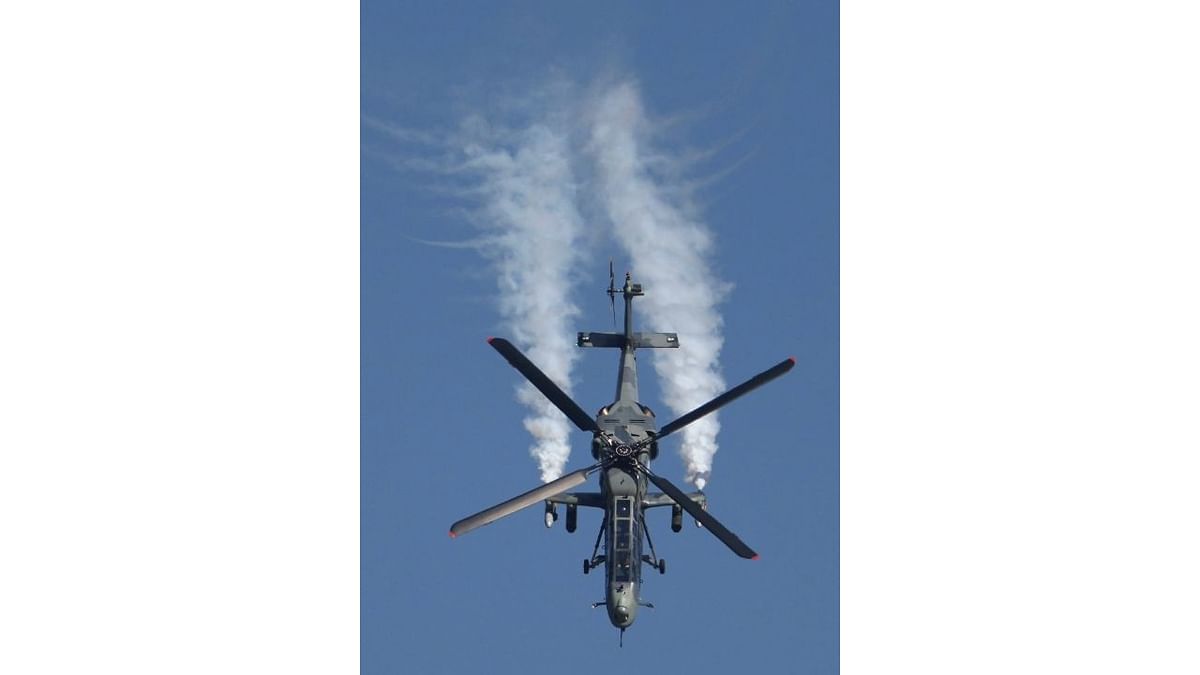 Indian Air Force's (IAF) Light Combat Helicopter (LCH) performs during the inauguration of Aero India 2023, at Yelahanka air base in Bengaluru. Credit: PTI Photo