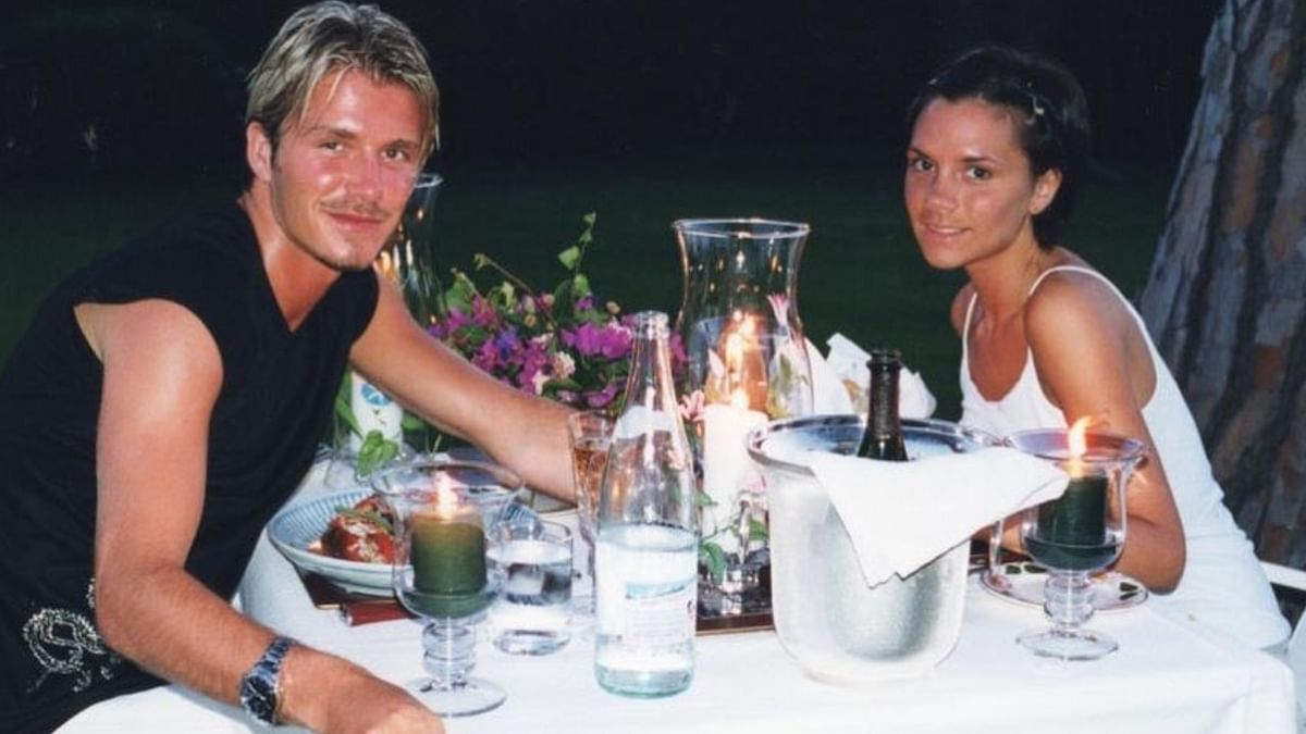 Soccer legend David Beckham celebrated the special day by sharing an adorable throwback photo where he is seen enjoying a candlelit dinner with his wife Victoria. Credit: Instagram/@davidbeckham