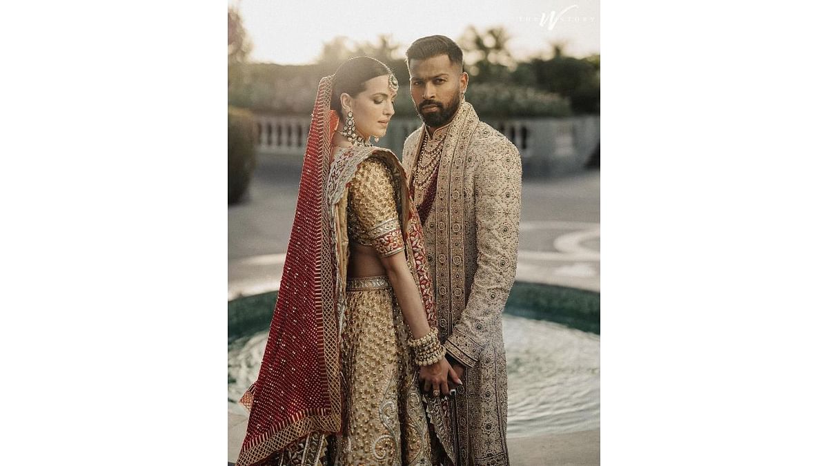 The wedding took place at a hotel in Udaipur on February 15. Hardik wore a cream-coloured sherwani while Natasa looked radiant in a cream-coloured lehenga with red border. Credit: Instagram/@hardikpandya93