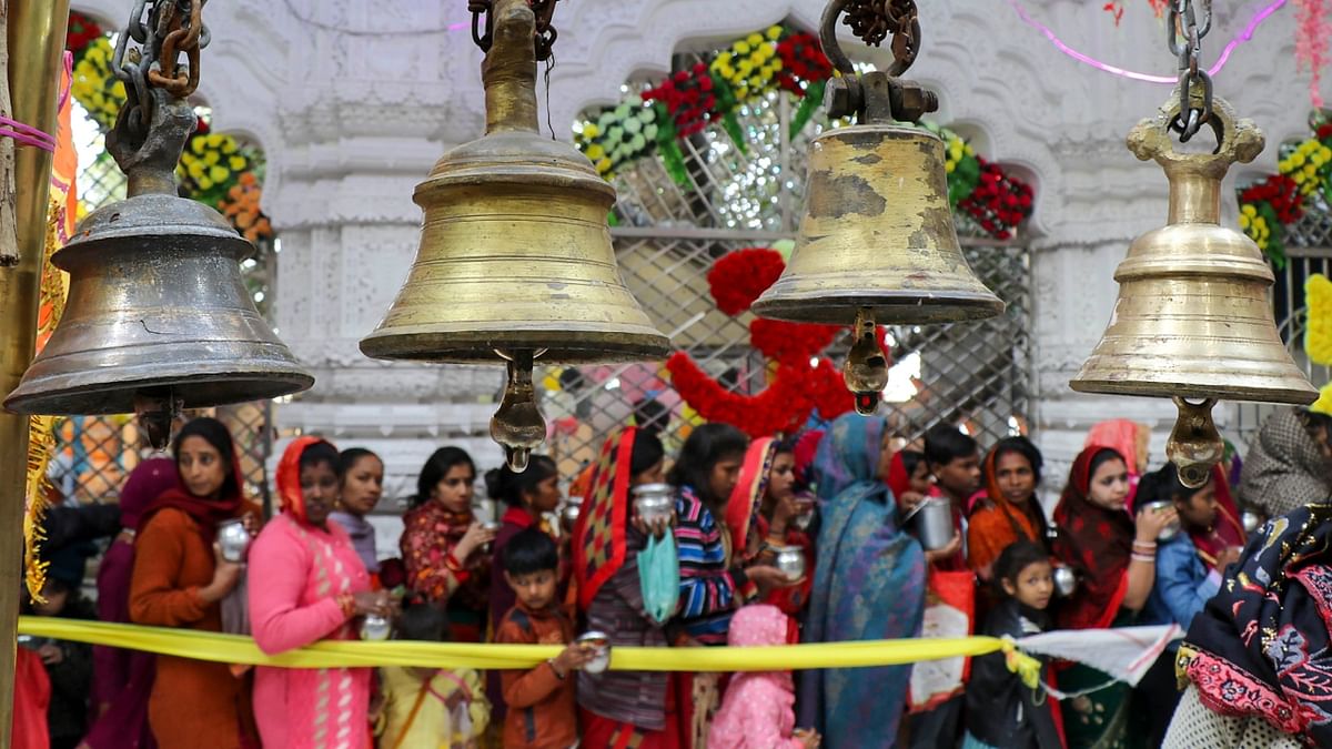 Devotees wait in queues to offer prayers at Aap Shambhu temple on the occasion of 'Maha Shivratri', in Jammu. Credit: PTI Photo