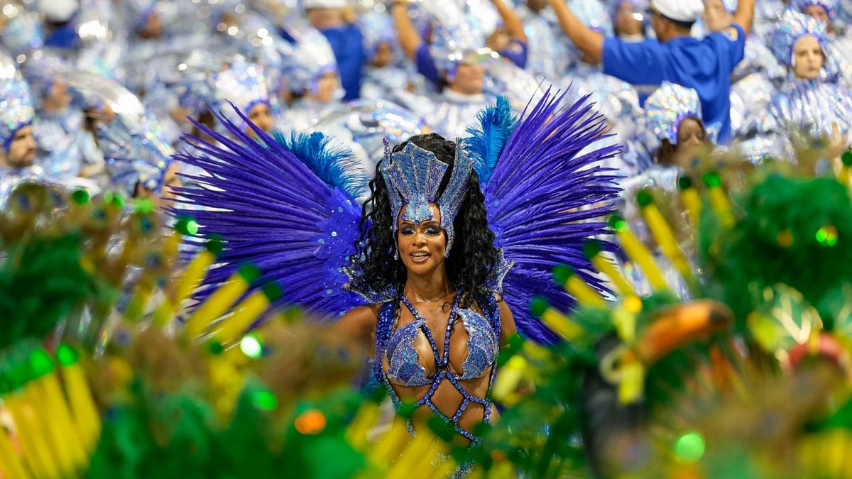 A dancer from the Academicos do Tatuape samba school performs during a carnival parade in Sao Paulo. Credit: AFP Photo