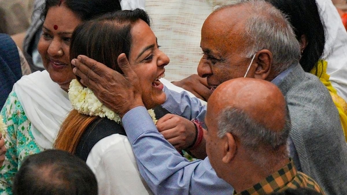 AAP's Shelly Oberoi being congratulated by party MP N D Gupta on her victory in the Mayoral election, at the Civic Centre in New Delhi. Credit: PTI Photo