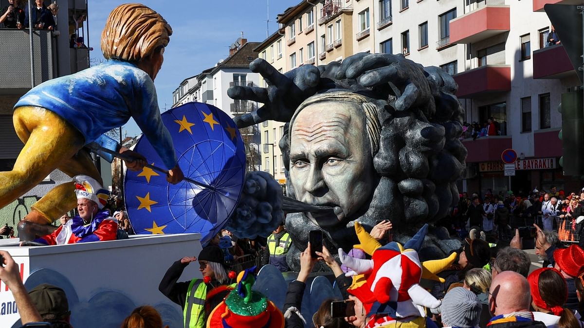 A canival float shows European Commission President Ursula von der Leyen's umbrella bearing the EU flag is her defence against the 'Cold East Wind' during the 'Rosenmontag' (Rose Monday) carnival parade in Mainz, Germany. Credit: Reuters Photo