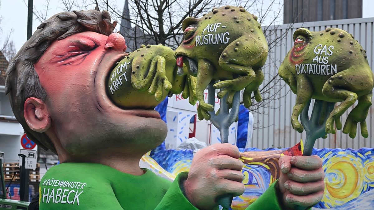 A float shows Green Party's Robert Habeck struggling to swallow three policies he and his party would traditionally love to decry when in opposition at the Rosenmontag 2023 in Germany. Credit: AFP Photo