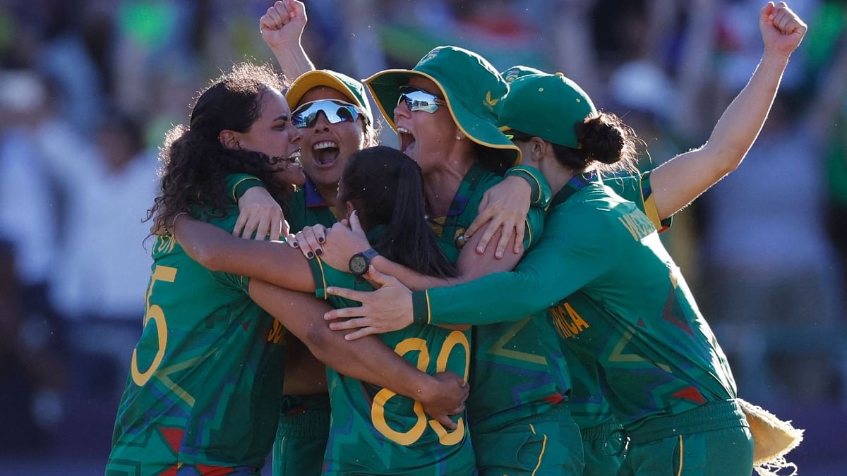 South African players celebrate winning the semi-final T20 women's World Cup cricket match between South Africa and England at Newlands Stadium in Cape Town on February 24, 2023. Credit: AFP Photo