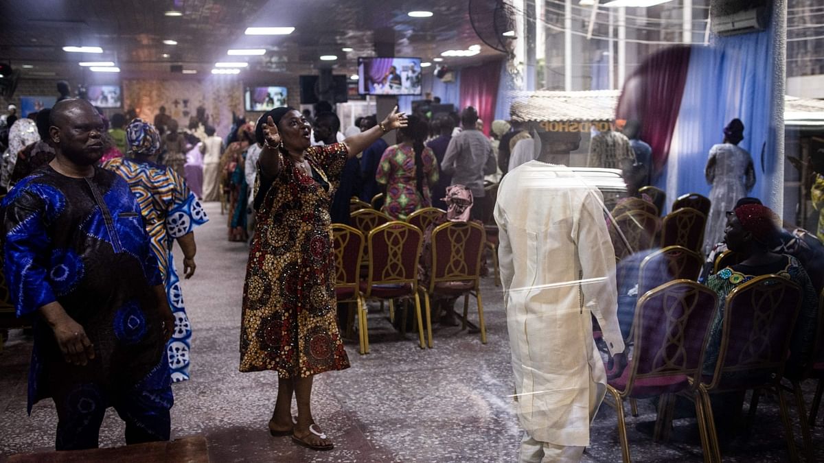 A worshipper rejoices during celebrations after a peaceful voting day at the Foursquare Gospel Church in Lagos, on February 26, 2023, the day after Nigeria's presidential and general election. Credit: AFP Photo