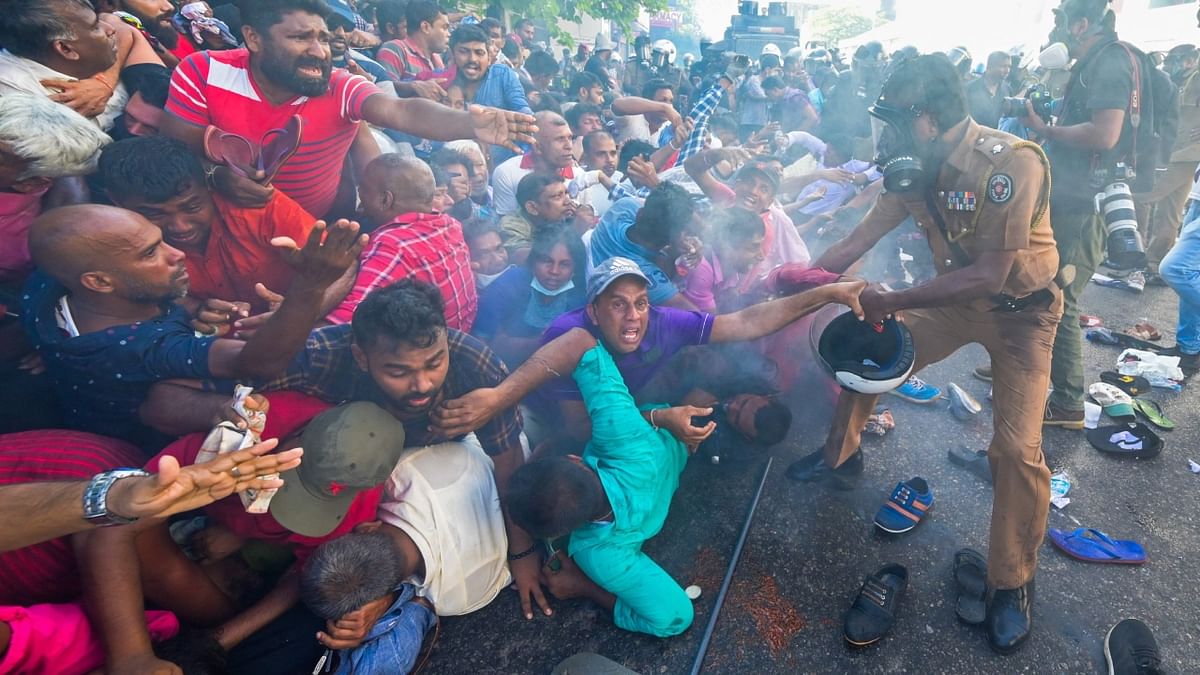 Police fire tear gas to disperse activists of the opposition National People’s Power (NPP) party during a protest held to urge the government to hold local council election as scheduled in Colombo on February 26, 2023. Credit: AFP Photo