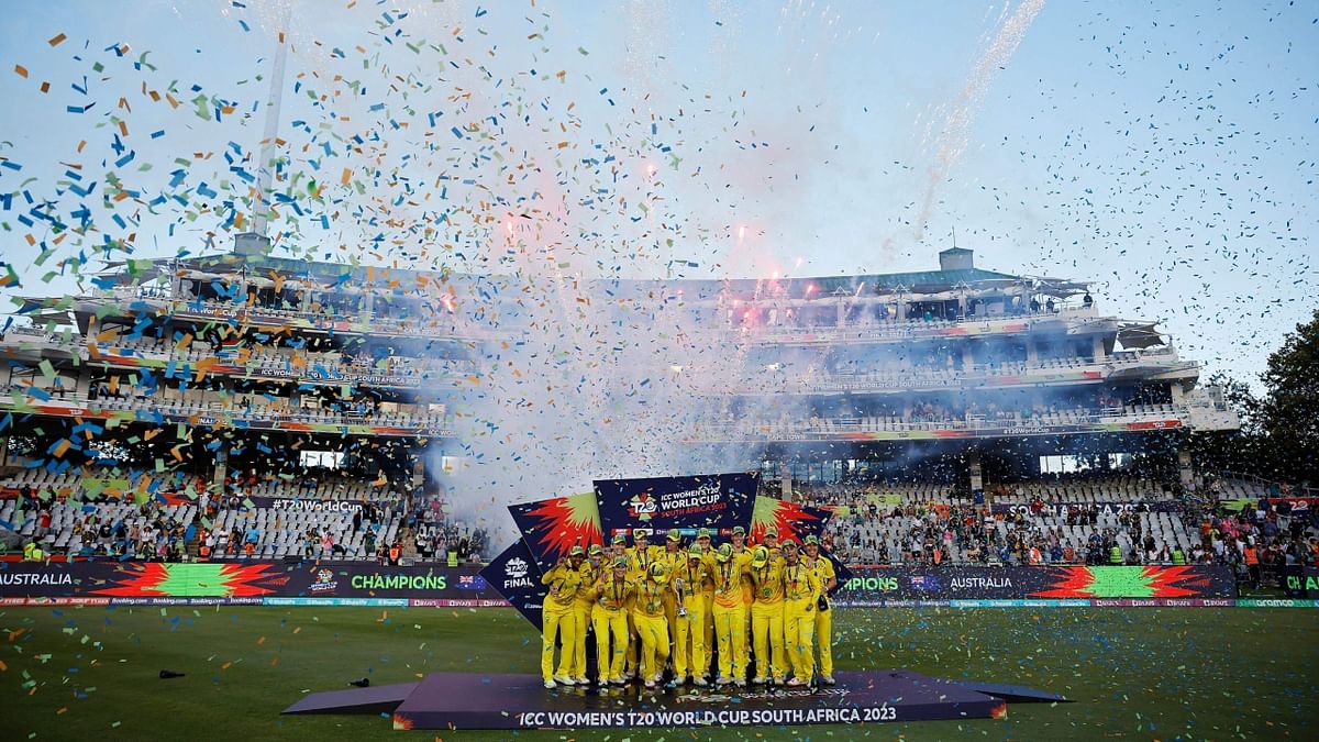 Australia's captain Meg Lanning (C) holds the trophy with her teammates after they won the final T20 women's World Cup cricket match against South Africa at Newlands Stadium in Cape Town on February 26, 2023. Credit: AFP Photo