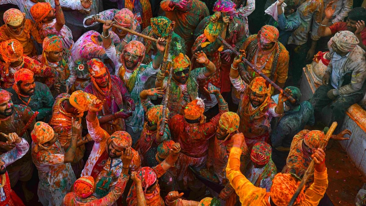 People play with colours during the traditional 'Lathmar Holi' in Barsana. Credit: PTI Photo