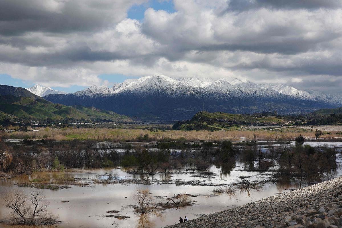 A major storm, which carried a rare blizzard warning for parts of Southern California, delivered heavy snowfall to the mountains with some snowfall reaching lower elevations in Los Angeles County. The National Weather Service called the storm 'one of the strongest ever' to impact southwest California as it also delivered widespread heavy rains and high winds. Southern California snowfall topped out at 6 feet at Mountain High with rain topping five inches at Cucamonga Canyon. Credit: Getty Images via AFP