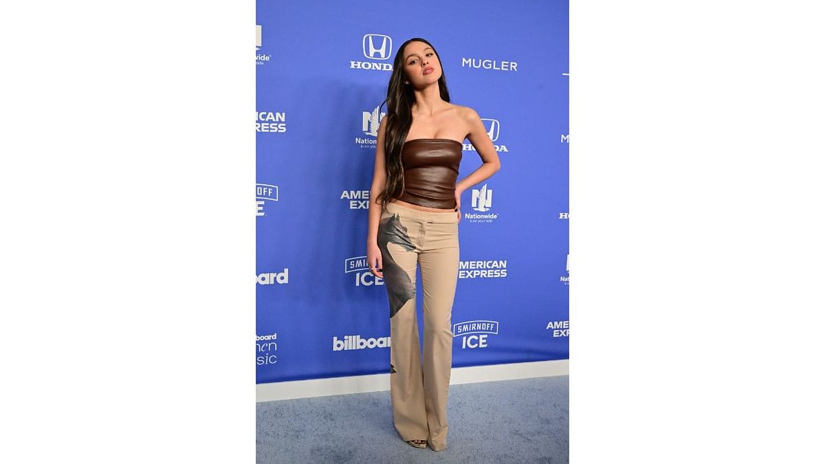US singer Olivia Rodrigo kept it classy in latex off shoulder top with trouser. Credit: AFP Photo