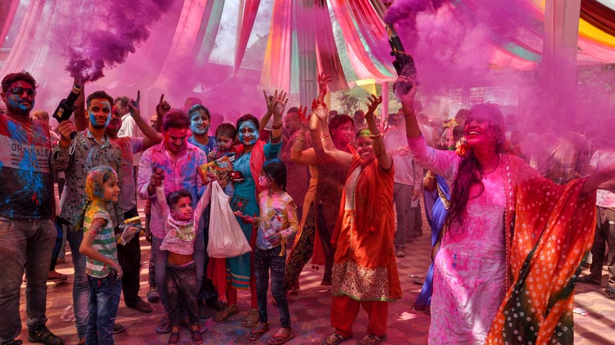 People celebrate Holi festival with colours, in Lucknow. Credit: PTI Photo