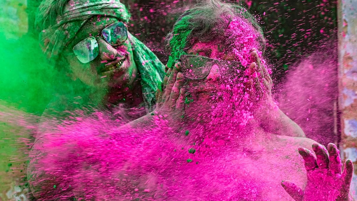 People play with colours during Holi festival, in Nadia, West Bengal. Credit: PTI Photo