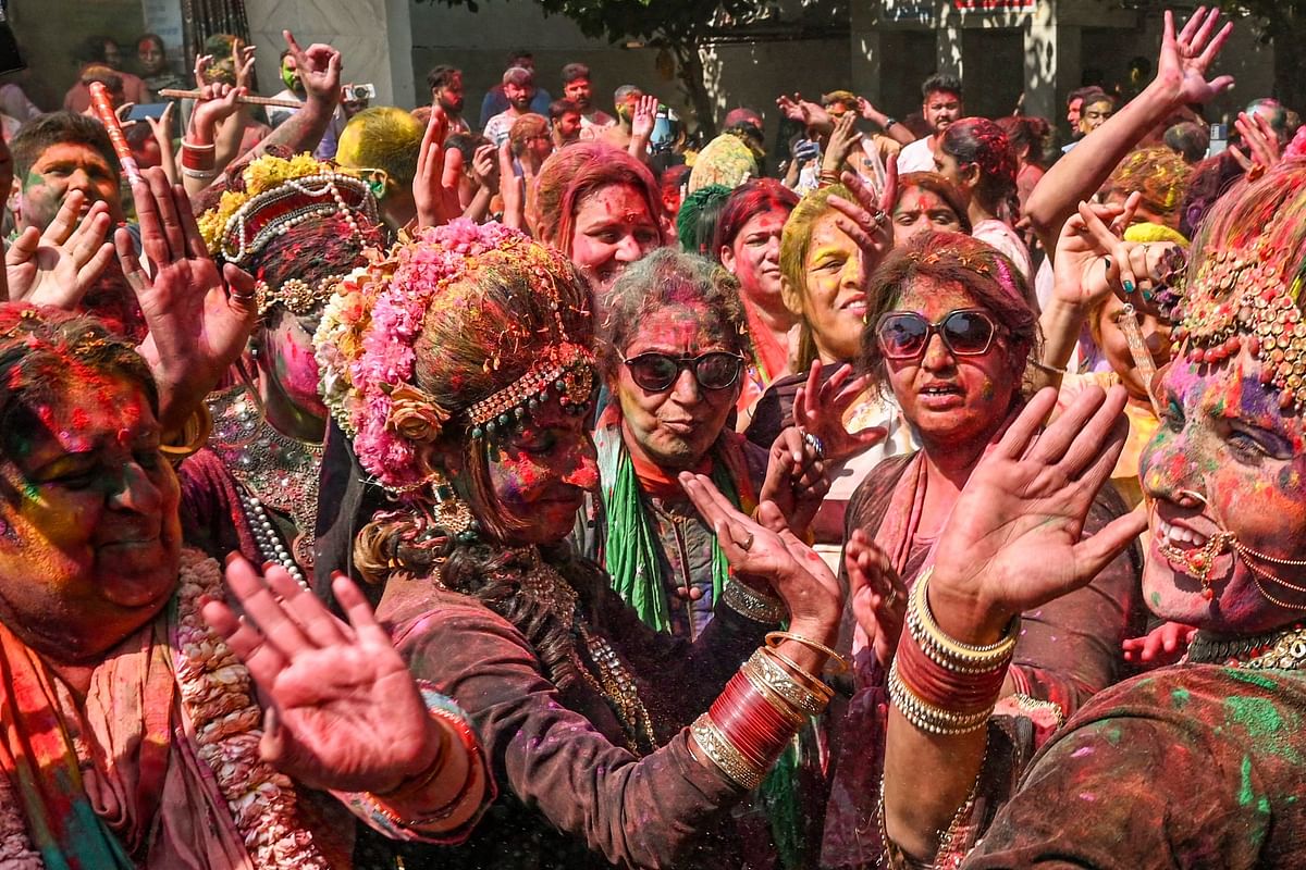 Artists dressed as goddess Radha dance along with devotees during celebrations for Holi, the Hindu spring festival of colours, at a temple in Amritsar. Credit: AFP Photo