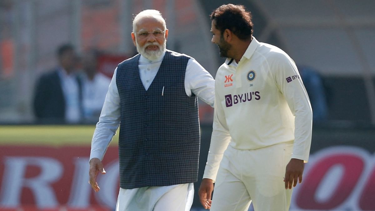 PM Modi and Team India captain Rohit Sharma are seen talking before the start of the match. Credit: Reuters Photo