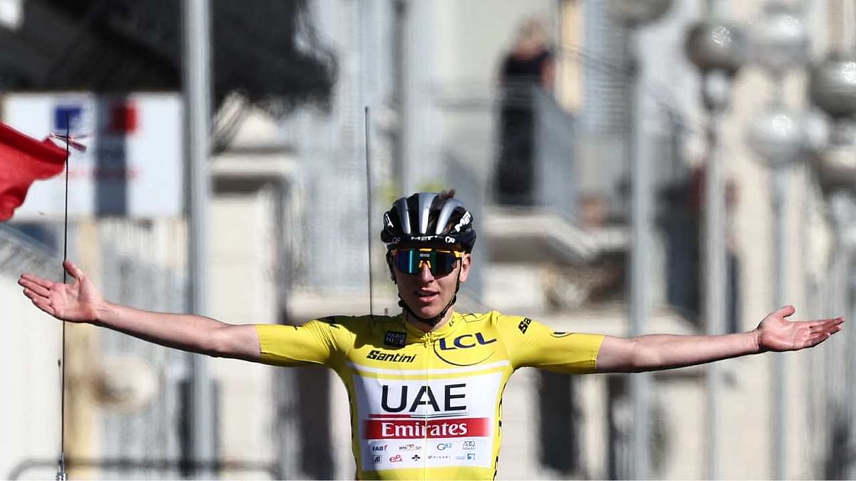 UAE Team Emirates' Slovenian rider Tadej Pogacar celebrates as he crosses the finish line of the 8th and final stage of the 81st Paris - Nice cycling race. Credit: AFP Photo