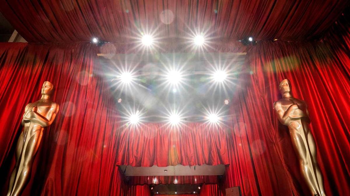 Decorative Oscar statues stands near spotlights and red drapes for the 95th Academy Awards, in Hollywood. Credit: AFP Photo