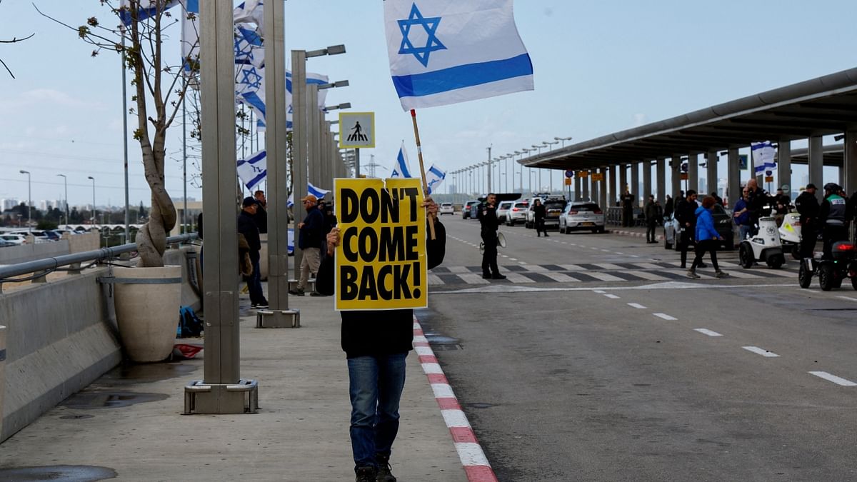 An Israeli protests outside the Ben Gurion International Airport. Credit: Reuters Photo
