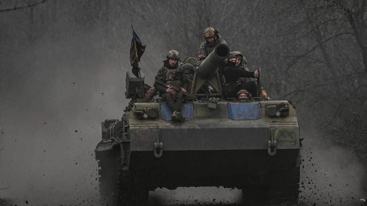 Ukrainian servicemen on a 2S7 Pion tank change positions near Bachmut, in the region of Donbas. Credit: AFP Photo