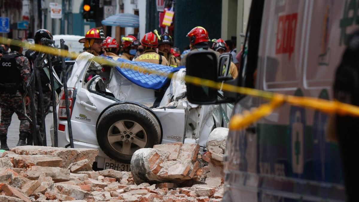 View of a destroyed car after the cornice and terrace of a building located in Cuenca's historic center fell, leaving one dead and one person injured, after an earthquake in Cuenca, Ecuador. Credit: AFP Photo