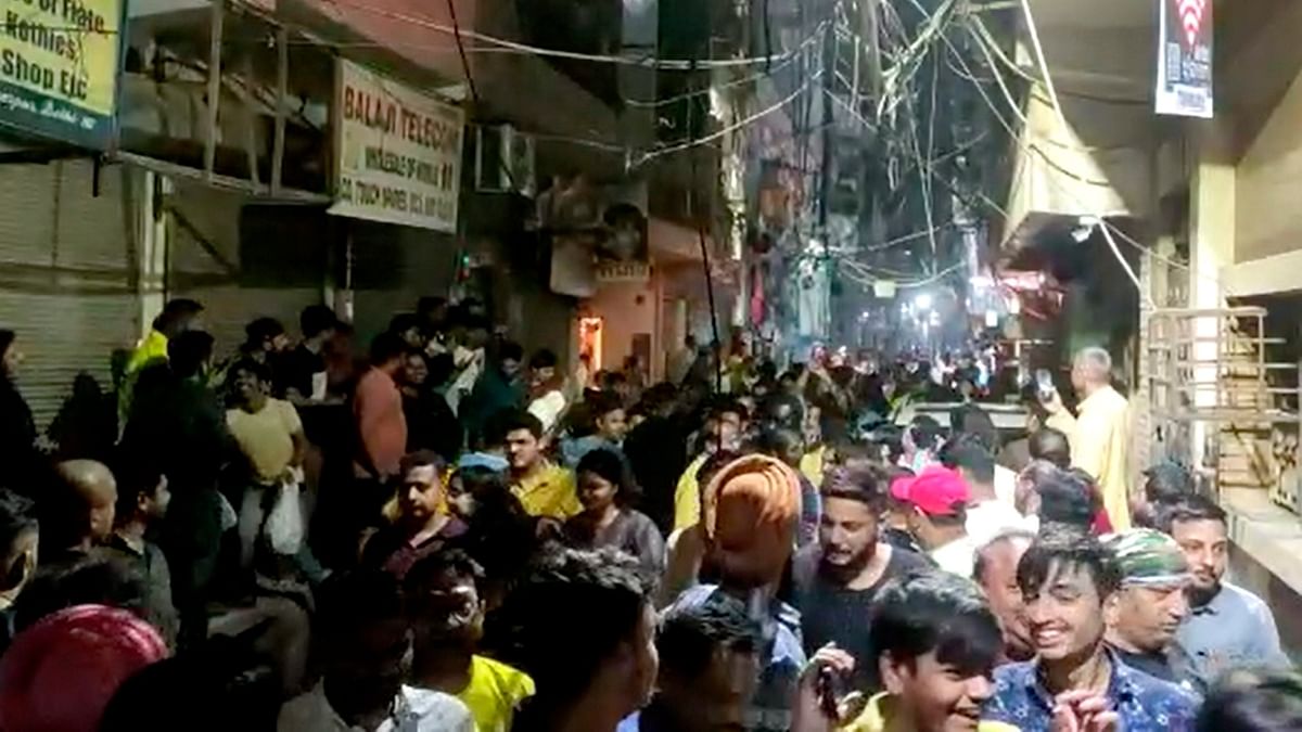 People rushed out of their homes and came out on the streets as the powerful tremor shook the national captial at 10.17 pm. Credit: PTI Photo