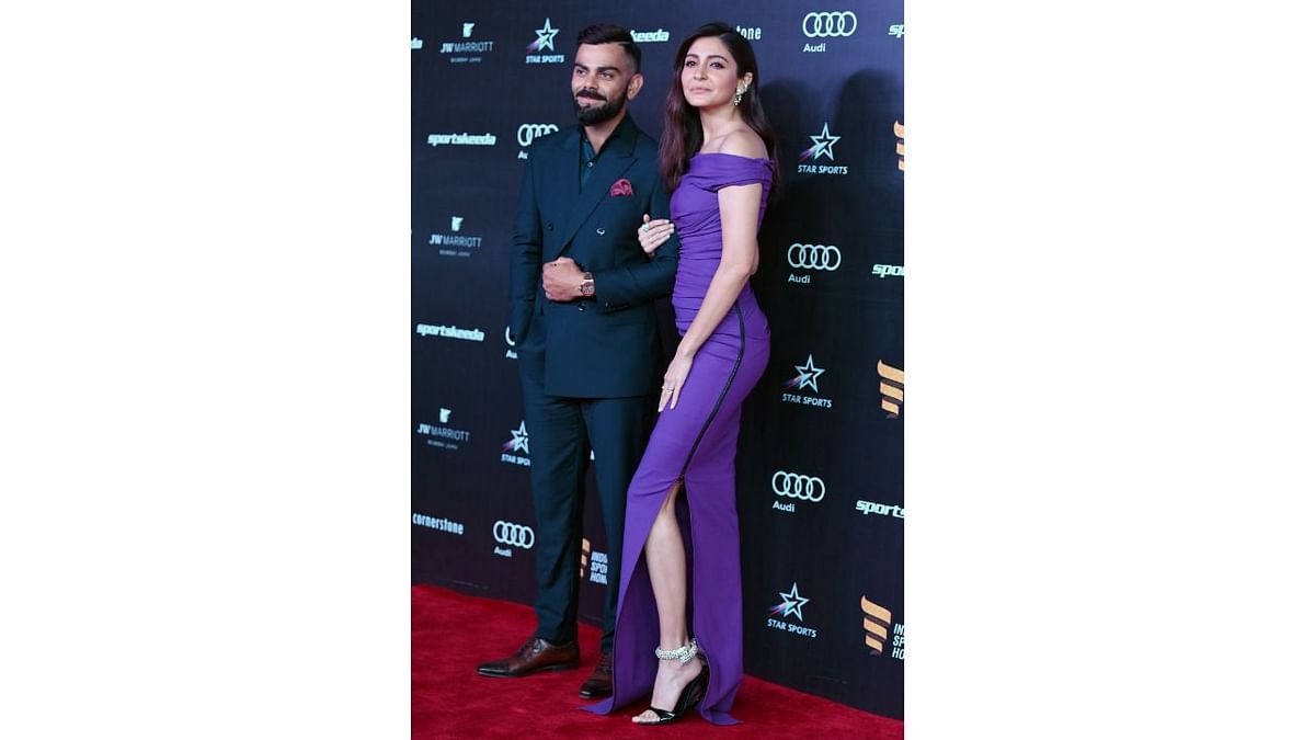 Celebrity couple Virat Kohli and Anushka Sharma pose as they walk the red carpet for the 'Indian Sports Honours' in Mumbai. Credit: AFP Photo