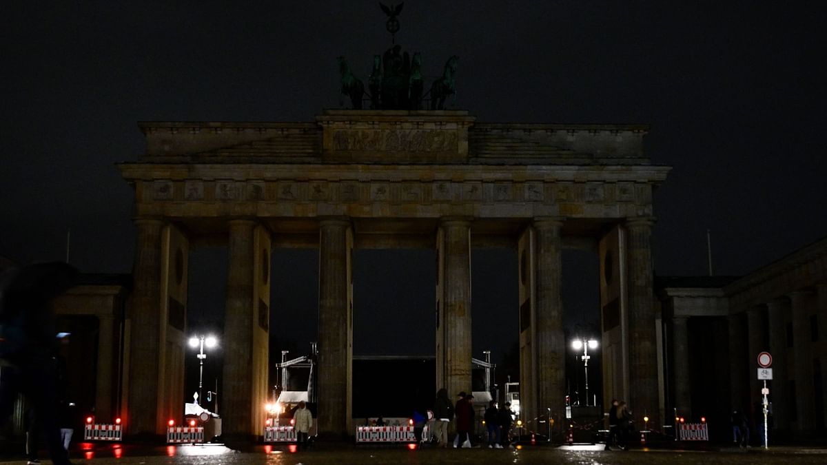 The lights of the Brandenburg Gate in Berlin are switched off for Earth Hour 2023. Credit: AFP Photo