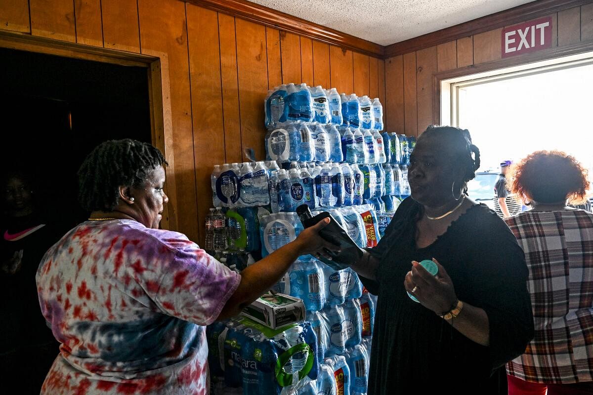 People collect essentials at a relief center in the aftermath of a tornado in Silver City, Mississippi. Credit: AFP Photo