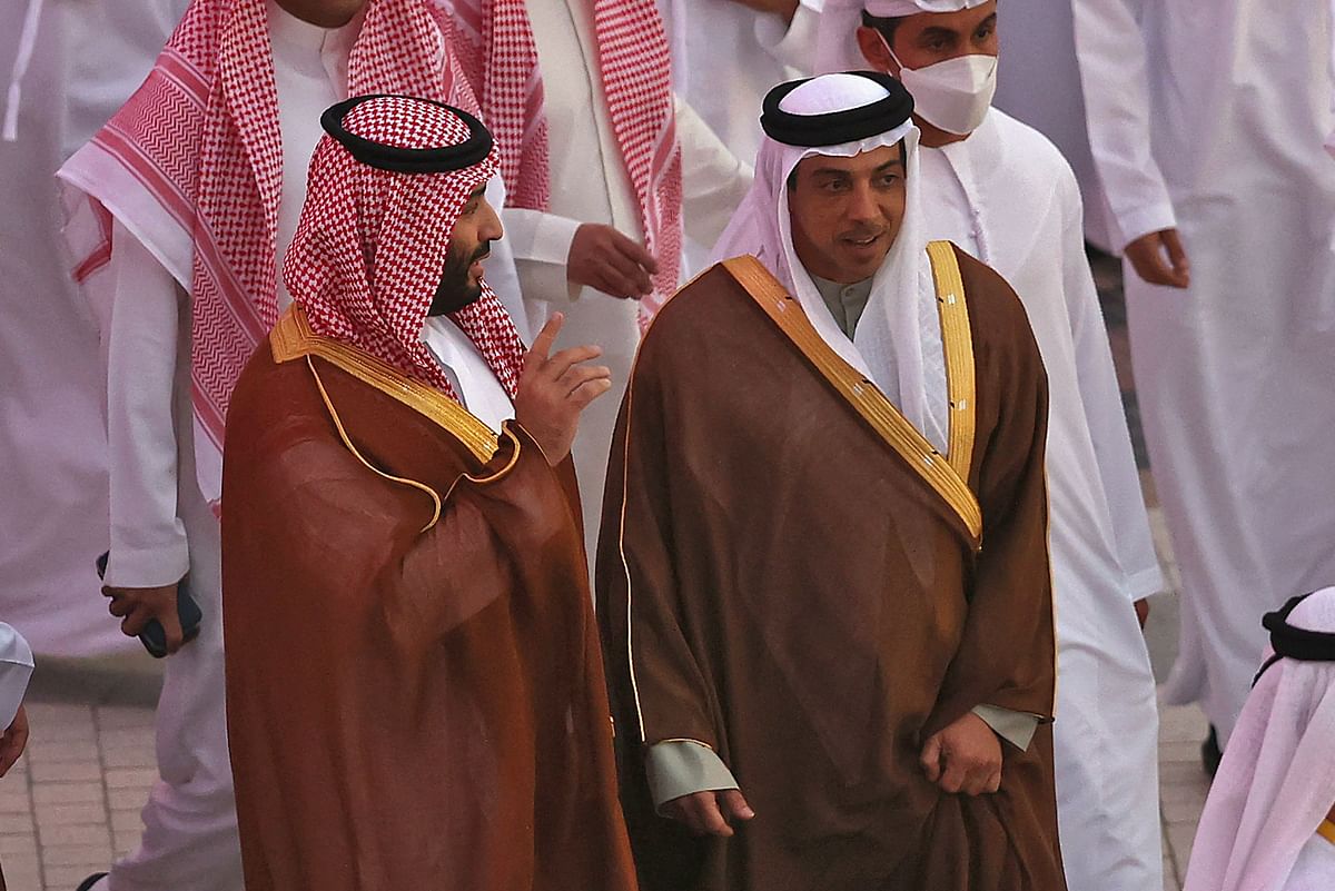 In this file photo taken on December 08, 2021 Saudi Arabia's Crown Prince Mohammed bin Salman (L) is toured around Expo 2020 Dubai by the UAE's deputy prime minister Sheikh Mansour bin Zayed Al-Nahyan (R), in the gulf emirate of Dubai. - Manchester City's owner Sheikh Mansour bin Zayed Al Nahyan was named as vice-president of the United Arab Emirates in a shake-up of the oil-rich Gulf monarchy's top ranks on March 29, 2023. Credit: AFP Photo