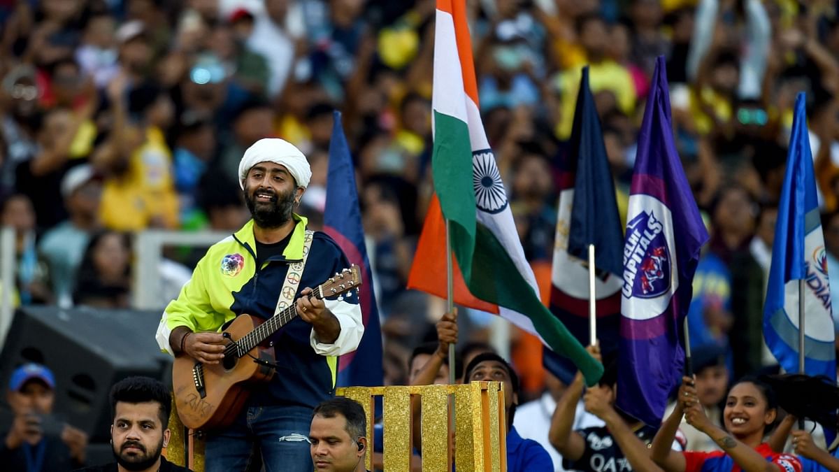 The IPL 2023 season began with a grand opening ceremony at the Narendra Modi Stadium where singer Arijit Singh wooed the audience with tracks like 'Kesariya', 'Jhoome Jo Pathaan', 'Pyaar Hota Kayi Baar Hai', 'Lehra Do', 'Dance Ka Bhoot', and more. Credit: AFP Photo