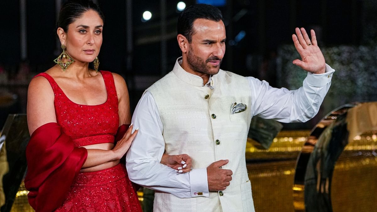 Kareena Kapoor and Saif Ali Khan made heads turn as they arrived in their red-white contrast. Credit: PTI Photo