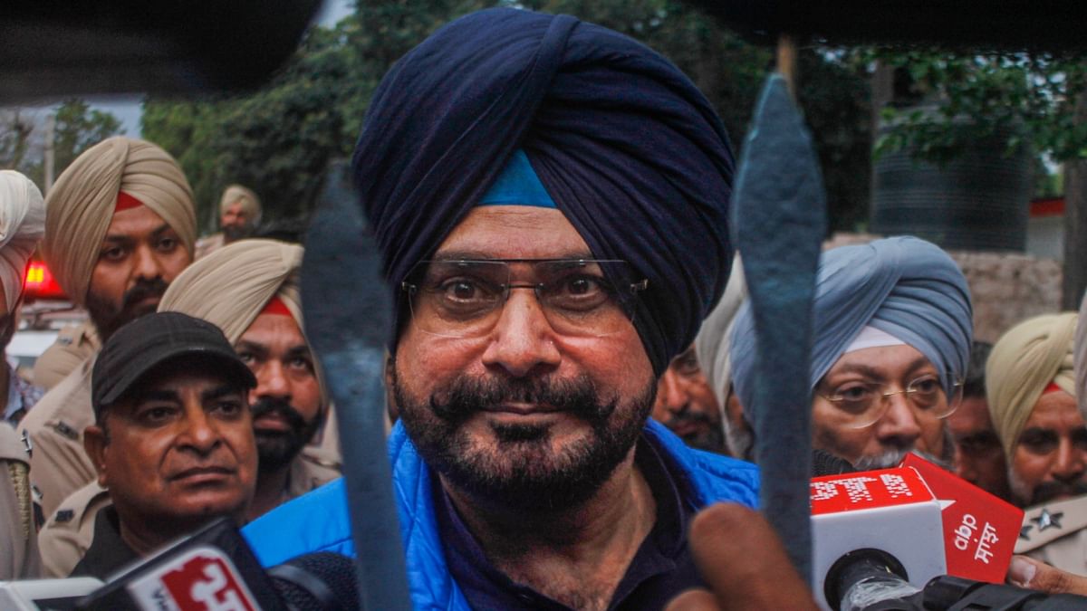 Donning a black turban and a Pathani suit with a blue jacket, former Punjab Congress chief Sidhu, who was released prematurely with a remission of 45 days in his prison term, said he was told that he would be released by 11.45 a.m. Credit: PTI Photo