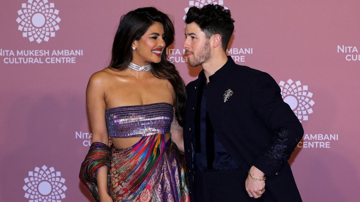 Priyanka Chopra and her husband Nick Jonas pose on the red carpet during the second day of the opening of Nita Mukesh Ambani Cultural Centre (NMACC) at Jio World Centre, in Mumbai. Credit: Reuters Photo