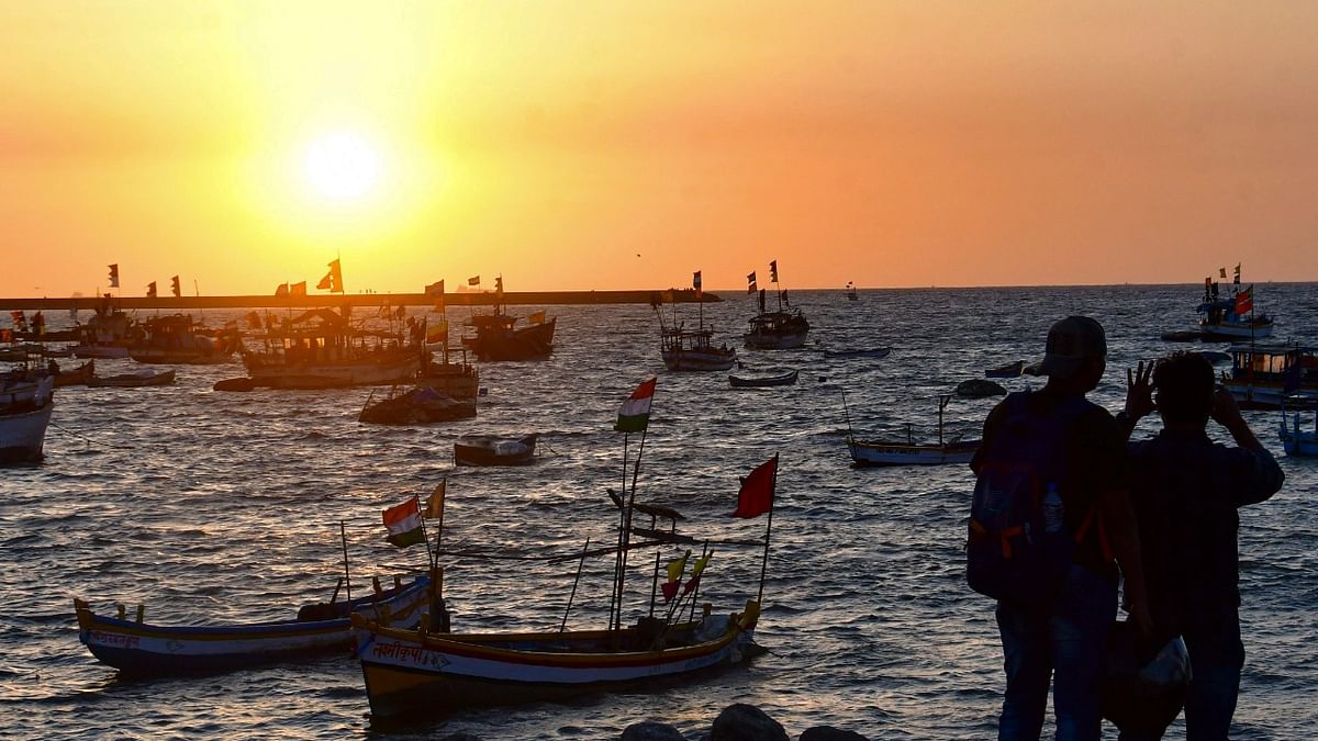 Fishermen gather at Badhwar Park after the navy and Coast Guard on High Alert after Suspicious Boat was Sighted near the Arabian coast, in Mumbai. Credit: PTI Photo
