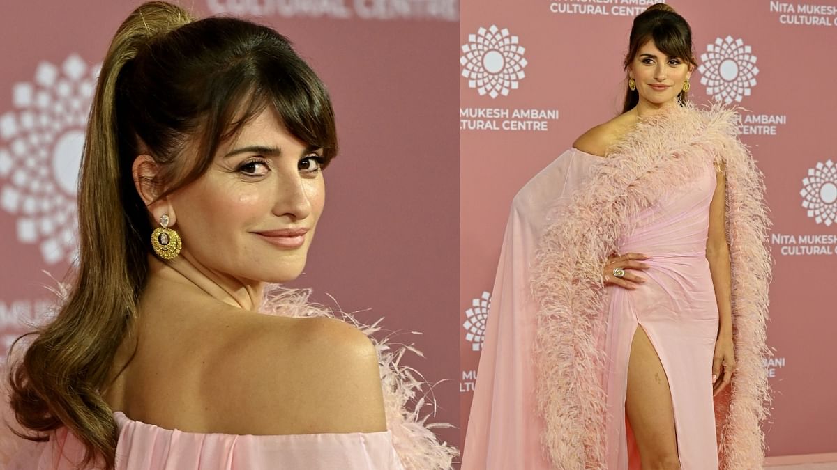 Penelope Cruz wore a gorgeous blush-pink thigh-high slit gown. The dramatic cape that she wore over her simple dress made the actress a head-turner. Credit: AFP Photo