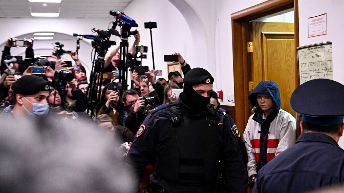 Darya Trepova, charged with terrorism over the April 2 bomb blast in a cafe in Saint Petersburg that killed military blogger Vladlen Tatarsky (real name Maxim Fomin), is escorted inside the Basmanny district court for her remand hearing in Moscow. Credit: AFP Photo