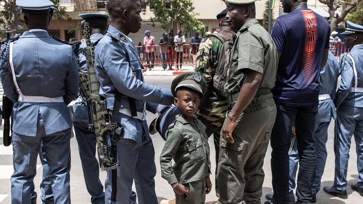 A young boy dressed in a military uniform is seen during celebrations for Senegal’s 63rd Independence Day in Dakar. Credit: AFP Photo