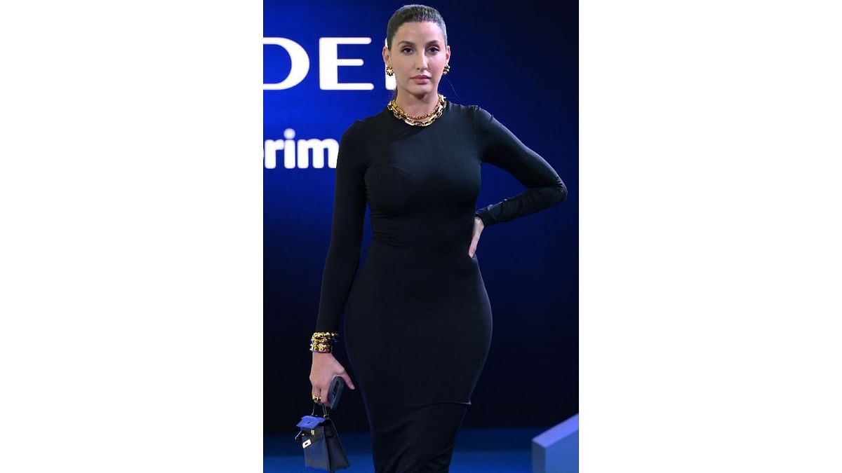 Internet sensation Nora Fatehi wowed all in a black body hugging dress paired with minimal gold jewels. Credit: AFP Photo