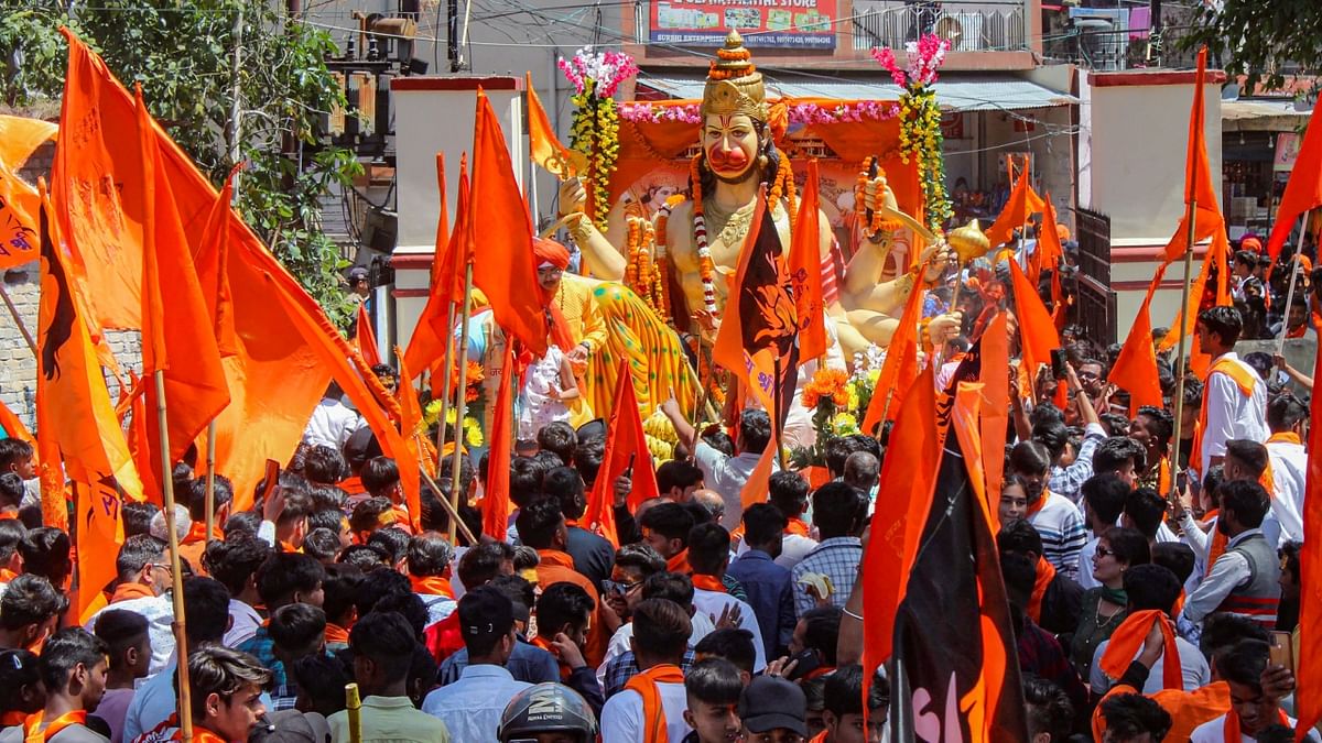Bajrang Dal and Vishva Hindu Parishad supporters take part in a religious procession on the occasion of 'Hanuman Jayanti', in Dehradun. Credit: PTI Photo