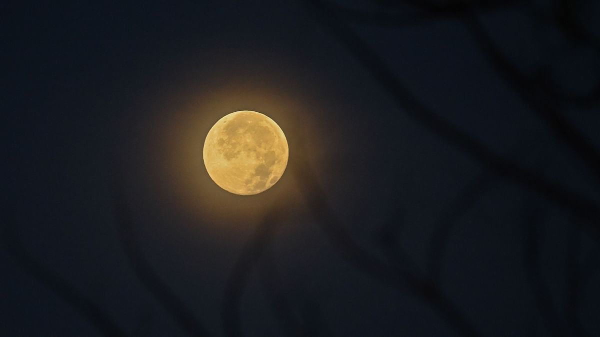 Social media lit up with amazing pictures of April full moon also known as the Pink Moon. Credit: AFP Photo