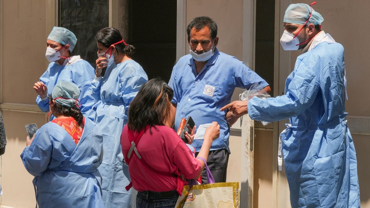 Healthcare workers during a mock drill to check Covid-19 preparedness amid rising cases of coronavirus, at RML Hospital, in New Delhi. Credit: PTI Photo