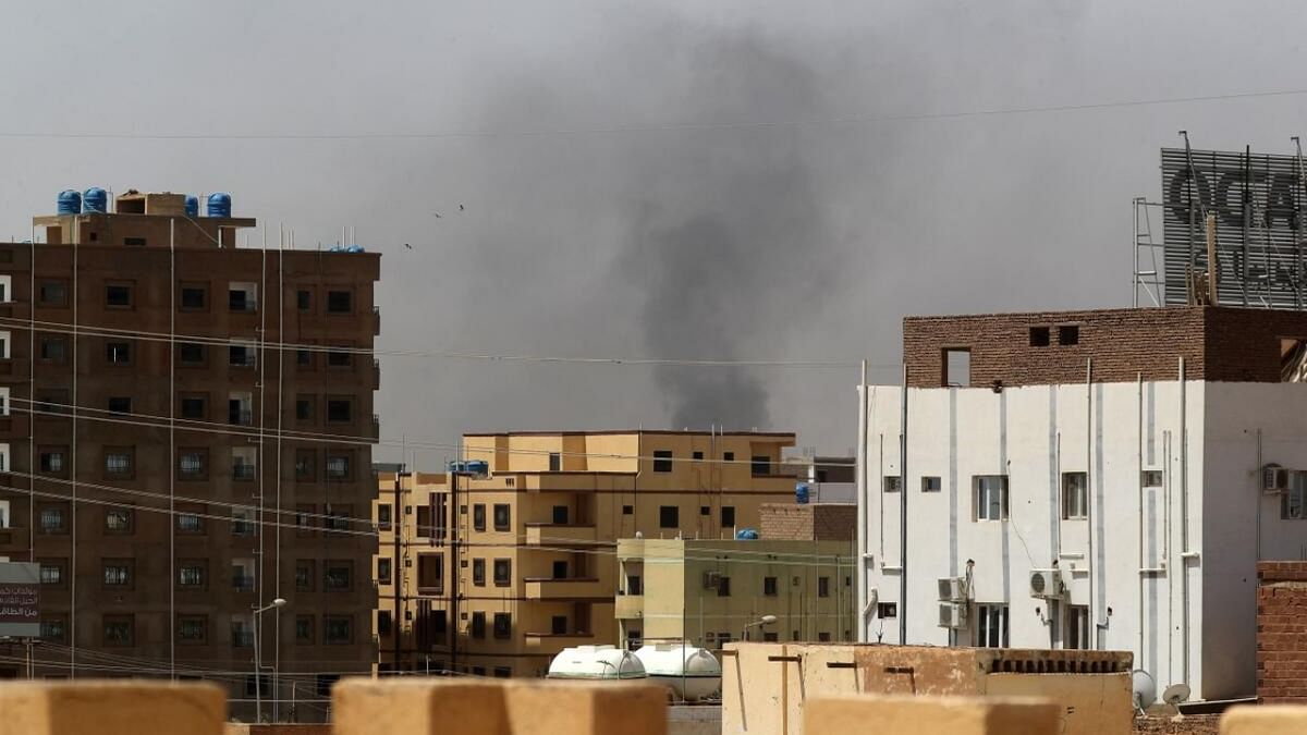 Smoke rises above buildings in Khartoum on April 15, 2023, amid reported clashes in the city. Credit: AFP Photo