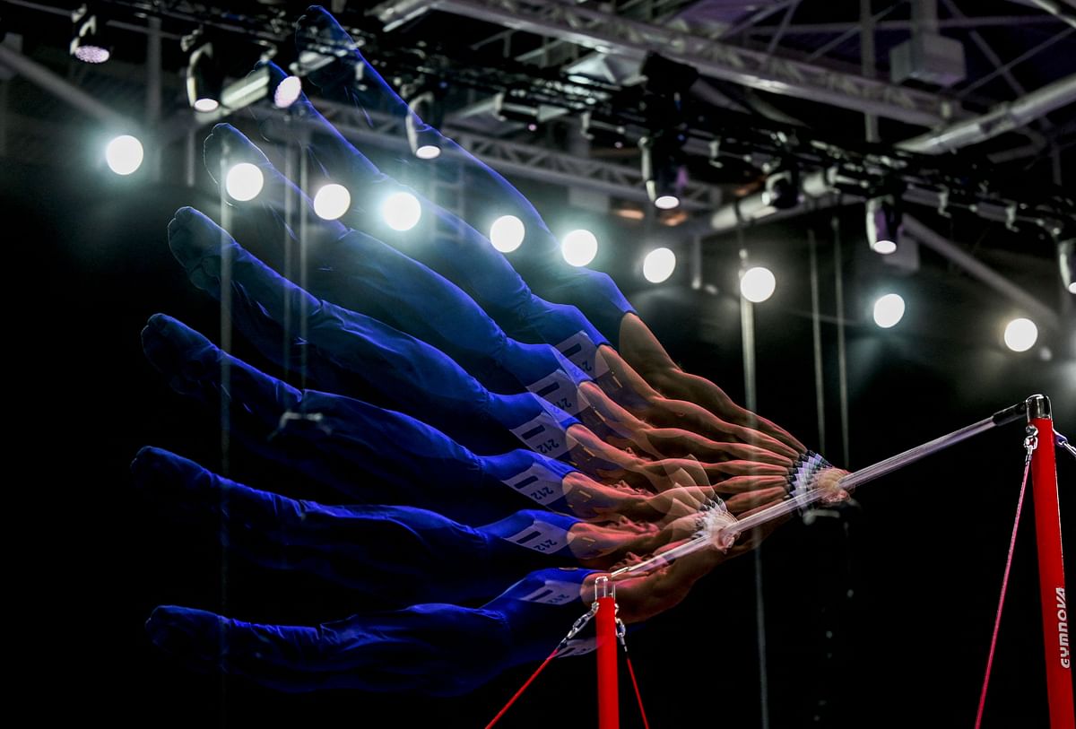 This multi-exposure photograph shows Italy's Carlo Macchini competing in the Men's high bar apparatus final event during the Artistic Gymnastics European Championships, in Antalya. Credit: AFP Photo