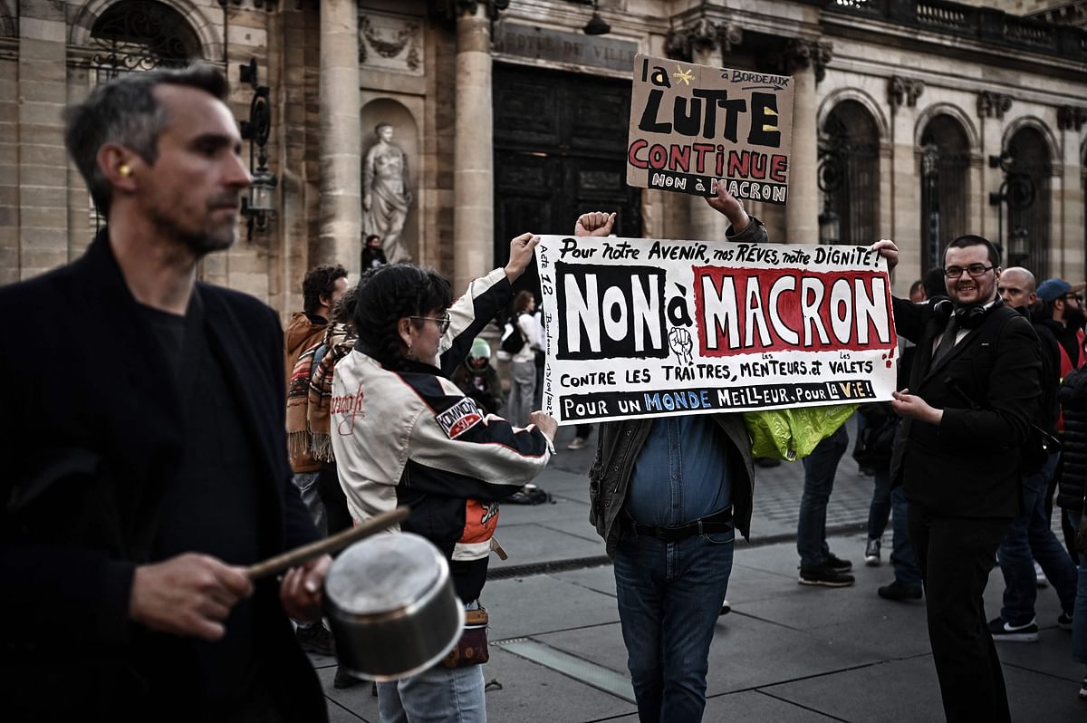 Demonstrators take part in a concert of pans to protest during French President Emmanuel Macron’s televised address. Credit: AFP Photo