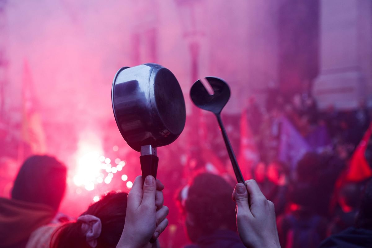 Demonstrators take part in a concert of pans to protest during French President Emmanuel Macron’s televised address to the nation. Credit: AFP Photo