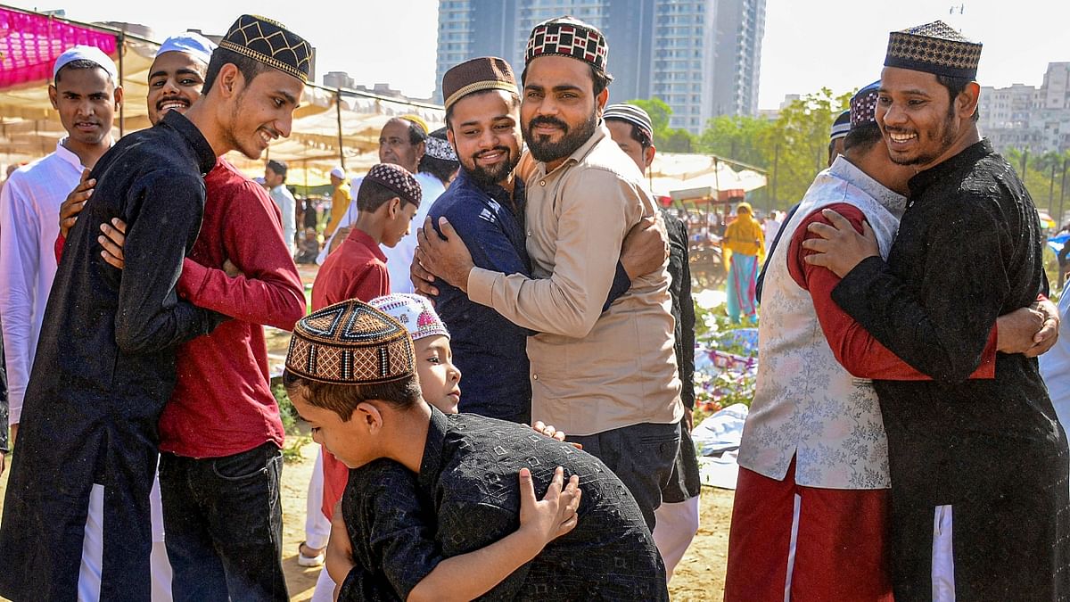 Muslims greet each other after offering Eid-al-Fitr prayers to mark the end of their holy fasting month of Ramadan, in Gurugram, Haryana. Credit: PTI Photo