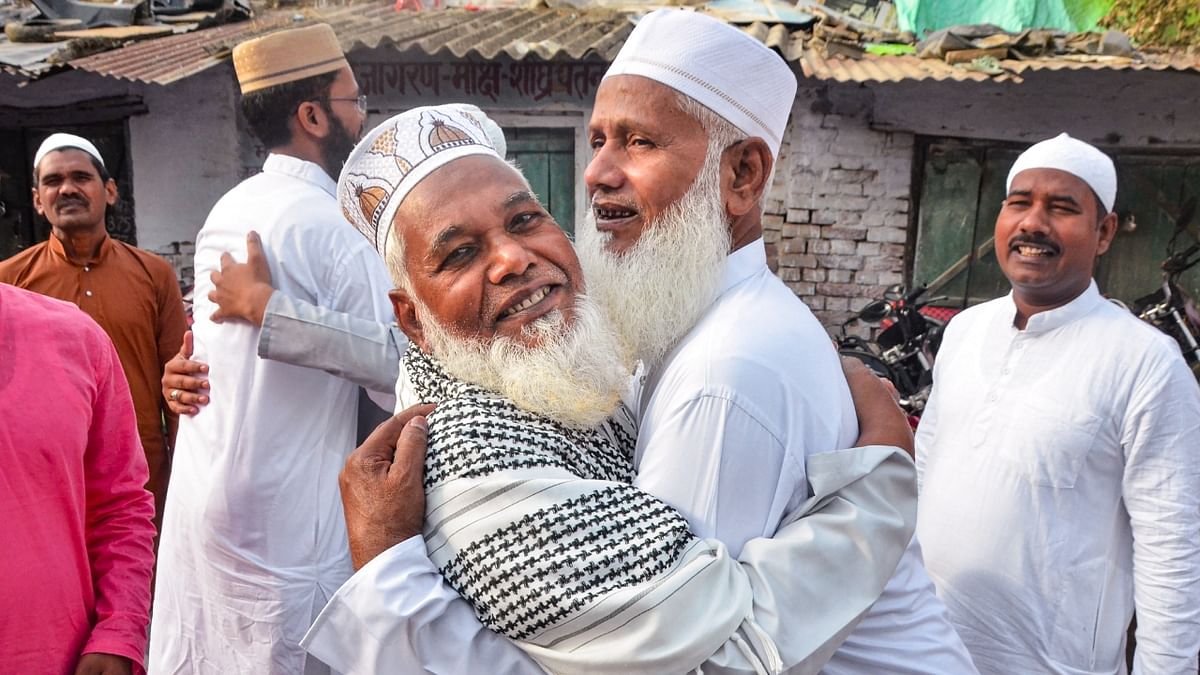 Muslims greet each other after offering Eid-ul-Fitr namaz, in Mirzapur, Uttar Pradesh. Credit: PTI Photo